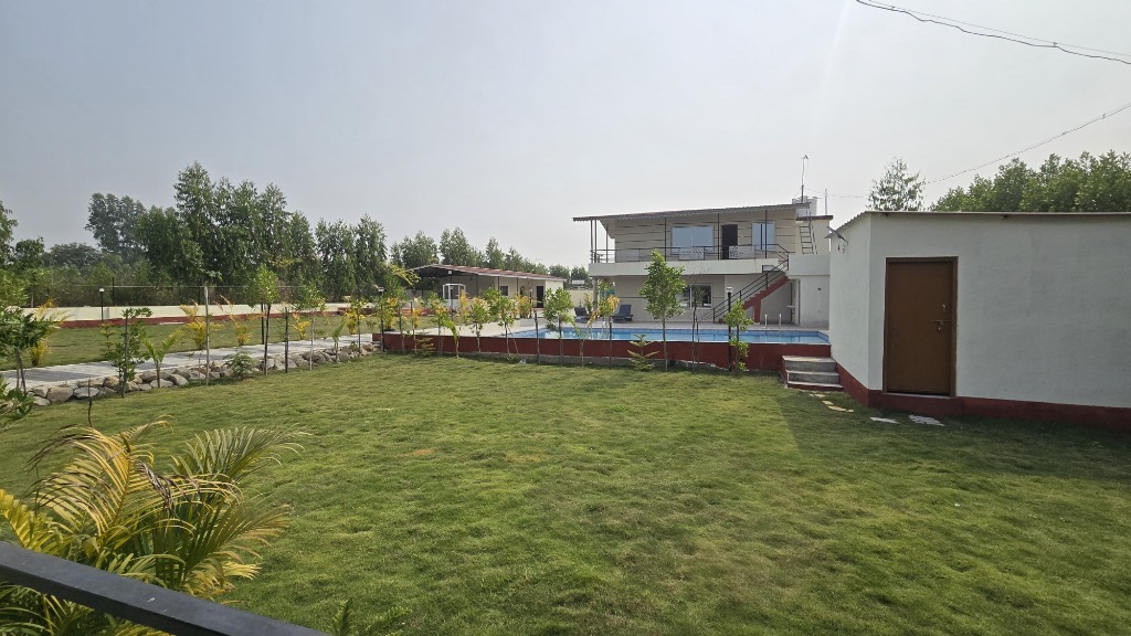 Lawn & Pool View at Krishna Farm